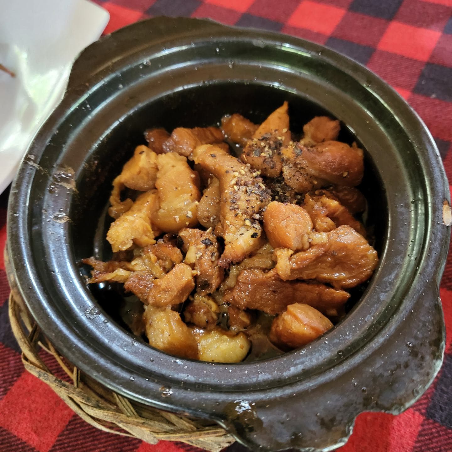 A clay pot of caramelised braised meat
