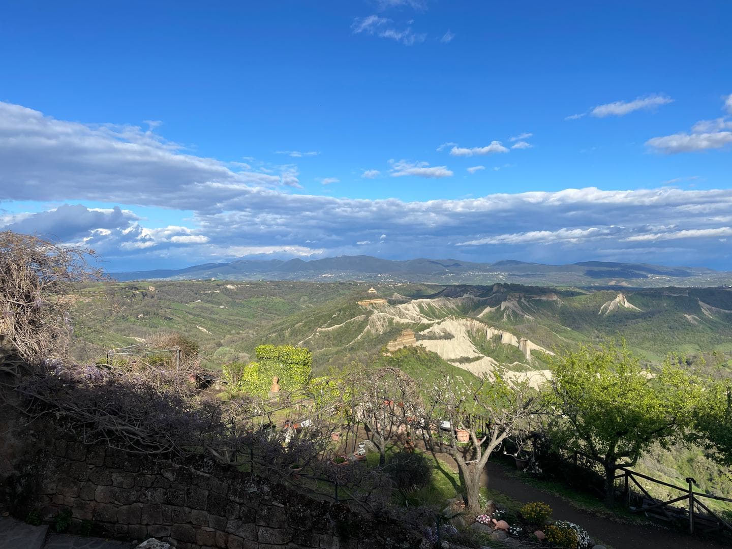 Eroded clay ridges and green valleys around Civita