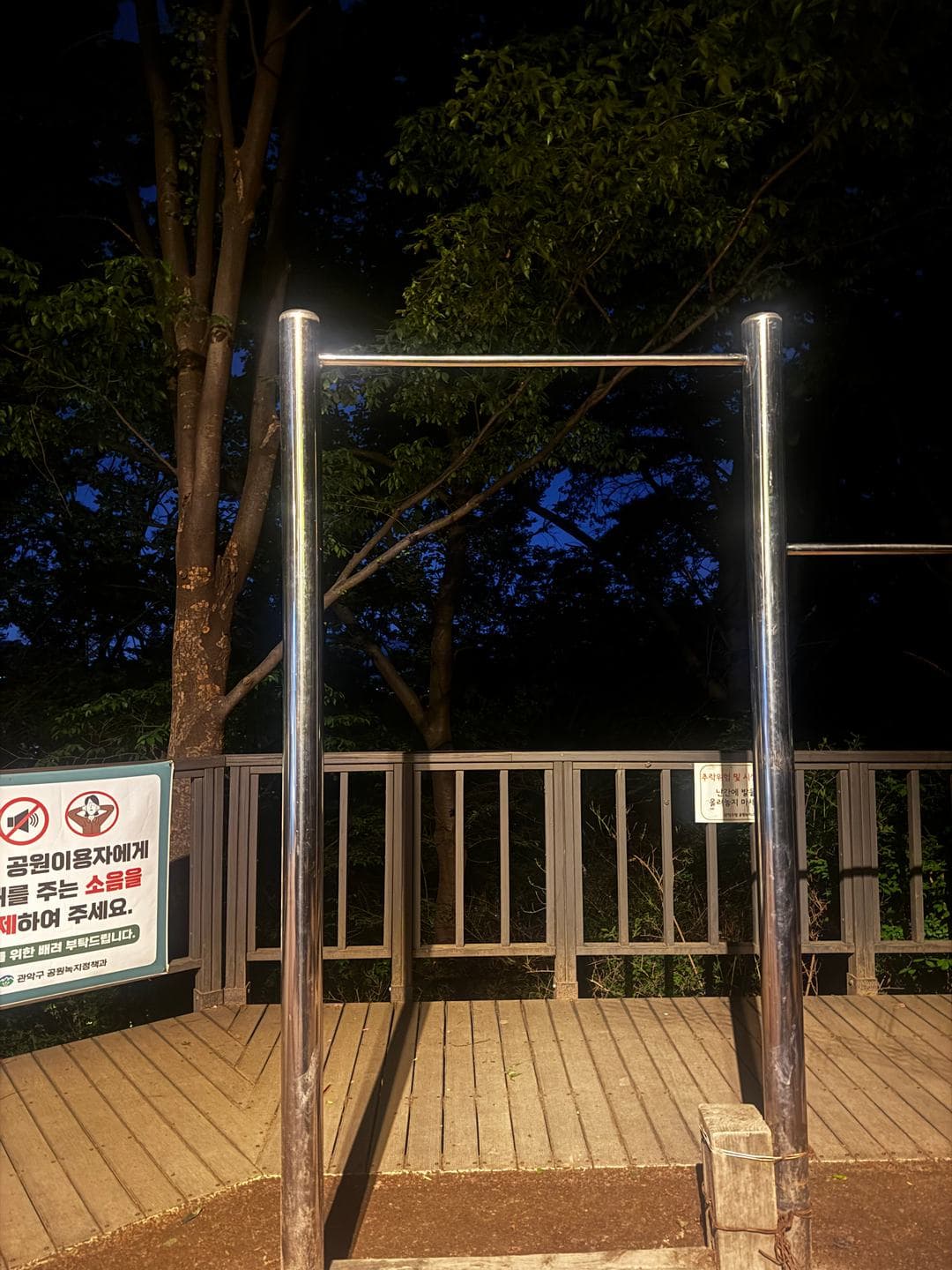 A pull-up bar on the deck at night