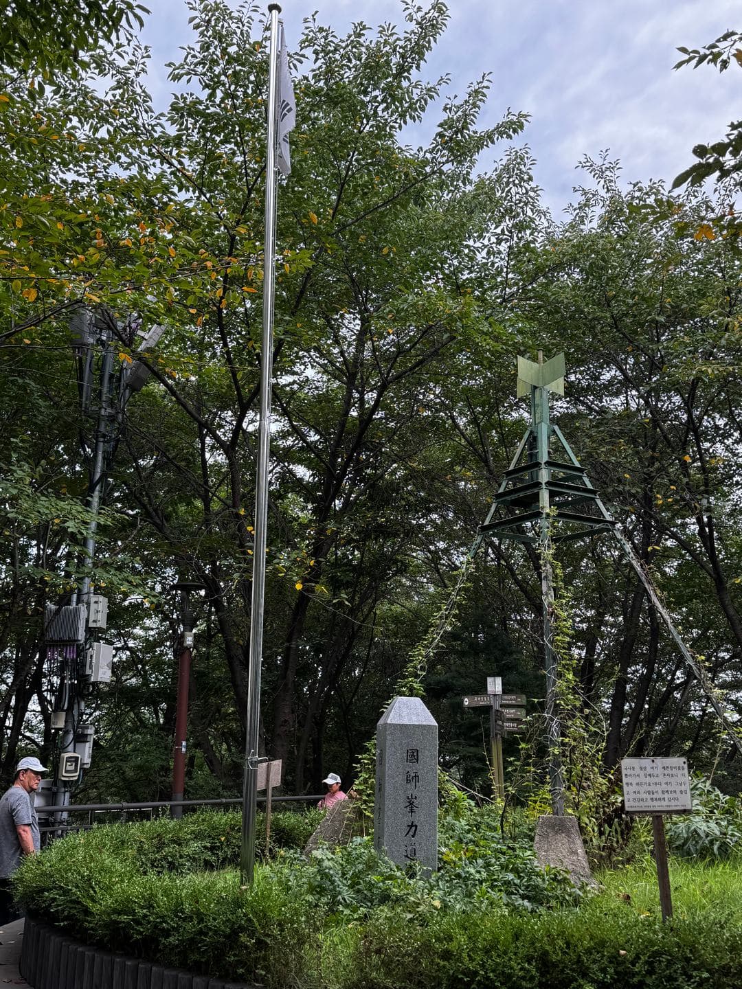 The summit stone and flagpole on a Sunday morning
