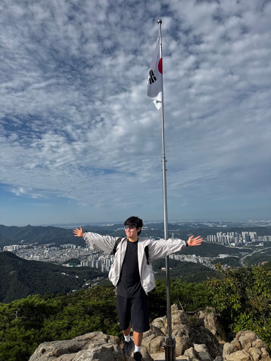 Arms wide open at the summit