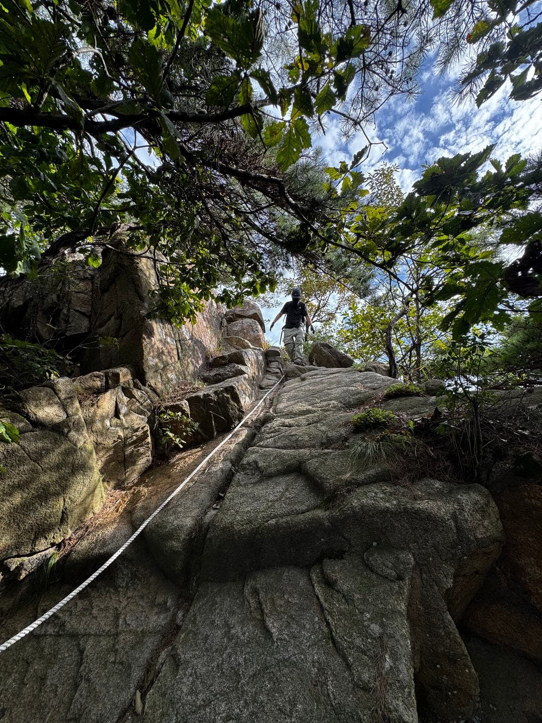 A granite ridge with a rope handrail